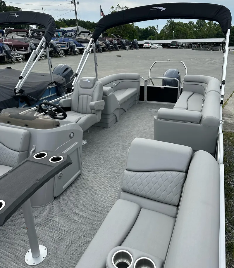 Slide: The Image of 2024 Bennington SV 22 Quad Bench pontoon boat with spacious seating and modern design. - 4
