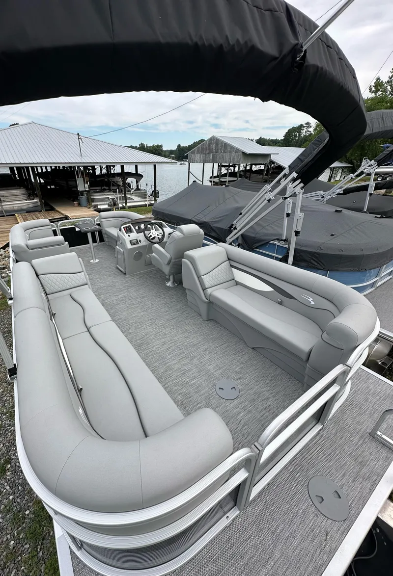 Slide: The Image of 2024 Bennington SV 22 Quad Bench pontoon boat with spacious seating and modern design. - 5