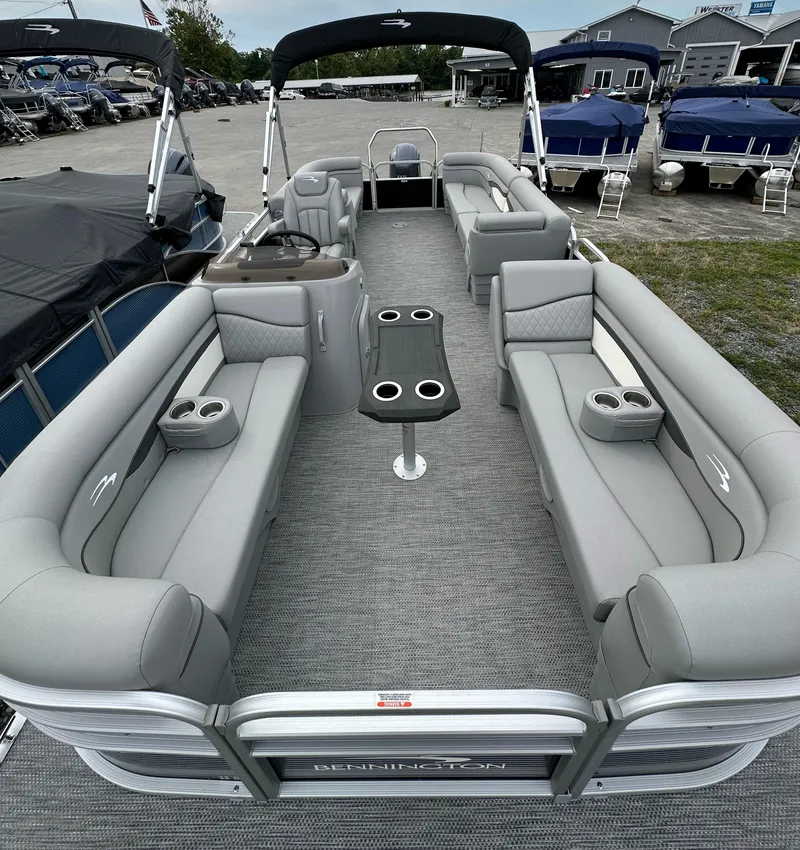 Slide: The Image of 2024 Bennington SV 22 Quad Bench pontoon boat with spacious seating and modern design. - 6