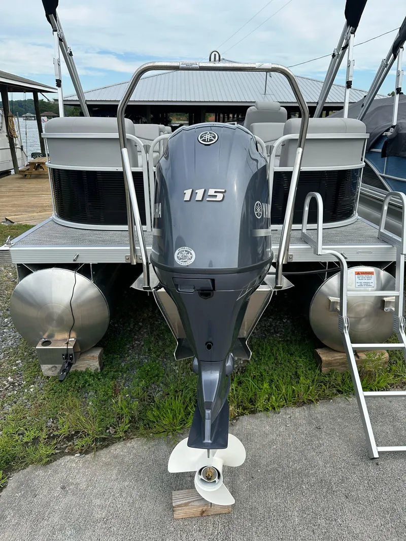 Slide: The Image of 2024 Bennington SV 22 Quad Bench pontoon boat with Yamaha 115 outboard motor. - 8
