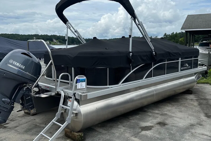 Slide: The Image of 2024 Bennington SV 22 Quad Bench pontoon boat with Yamaha engine, covered and docked. - 9