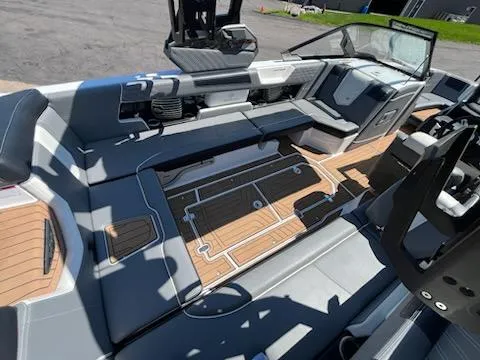 Slide: The Image of 2019 Correct Craft Nautique G 25 Super Air interior with sleek seating and modern design. - 10