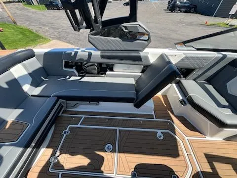 Slide: The Image of 2019 Correct Craft Nautique G 25 Super Air interior with sleek seating and modern design. - 11