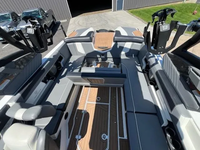Slide: The Image of 2019 Correct Craft Nautique G 25 Super Air interior with sleek seating and modern design. - 14