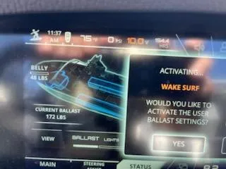 Slide: The Image of Dashboard of 2019 Correct Craft Nautique G 25 Super Air, displaying wake surf settings. - 16