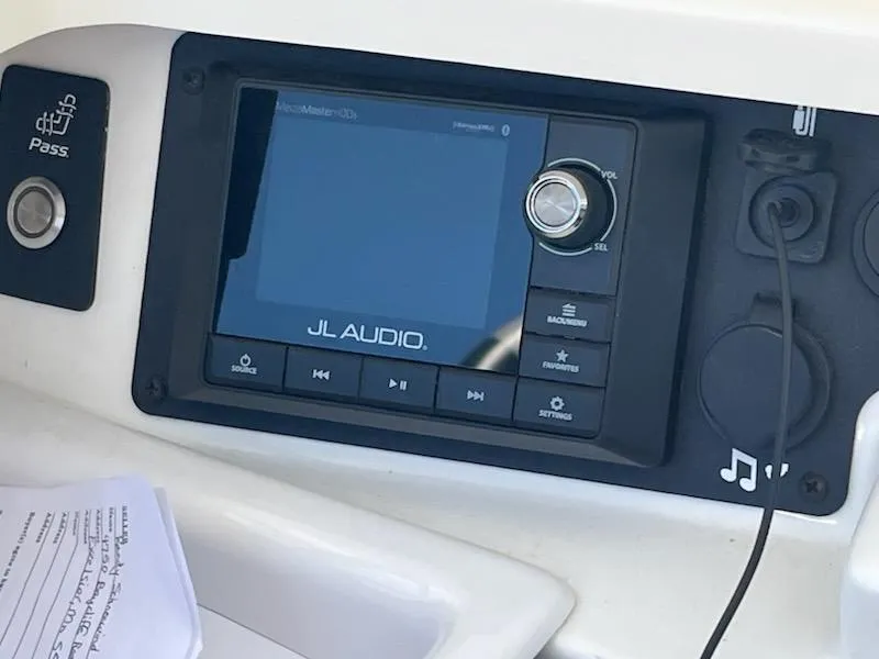 Slide: The Image of Control panel of 2019 Correct Craft Nautique G 25 Super Air with JL Audio system. - 18