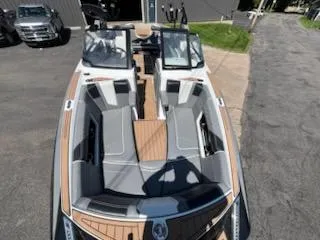 Slide: The Image of 2019 Correct Craft Nautique G 25 Super Air boat with sleek seating and modern design. - 26
