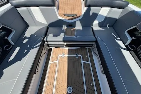 Slide: The Image of 2019 Correct Craft Nautique G 25 Super Air interior with sleek seating and teak flooring. - 27