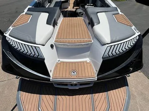 Slide: The Image of 2019 Correct Craft Nautique G 25 Super Air boat with sleek design and wood accents. - 7