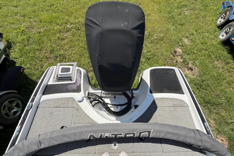 Slide: The Image of 2018 Nitro Z19 Sport boat deck with motor cover, viewed from above on grass. - 10