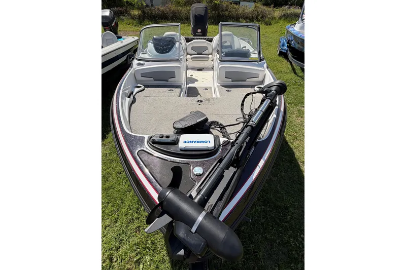 Slide: The Image of 2018 Nitro Z19 Sport boat with trolling motor and Lowrance electronics on grassy area. - 3