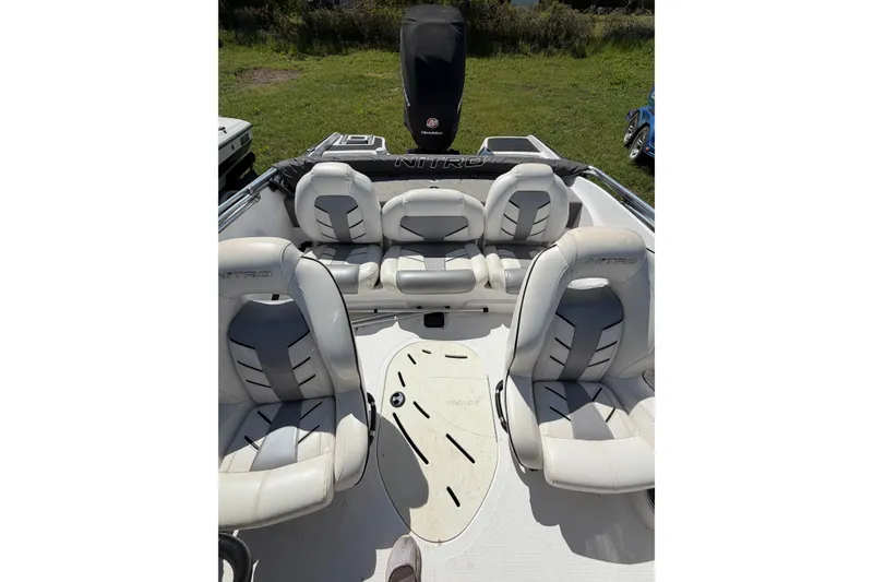 Slide: The Image of 2018 Nitro Z19 Sport boat interior with white seating and spacious layout. - 6