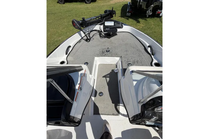 Slide: The Image of 2018 Nitro Z19 Sport boat interior with plush seating and modern dashboard. - 7