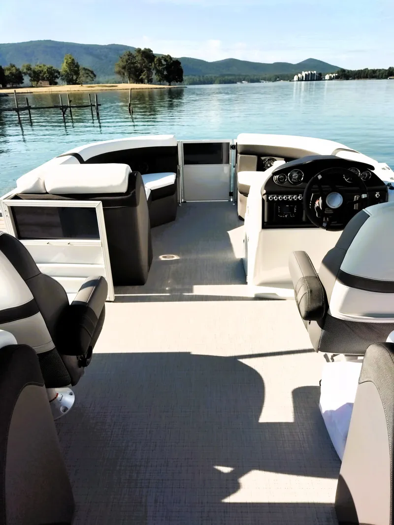 Slide: The Image of 2024 Berkshire 22RFX CTS 3.0 Performance pontoon boat interior with scenic lake view. - 5