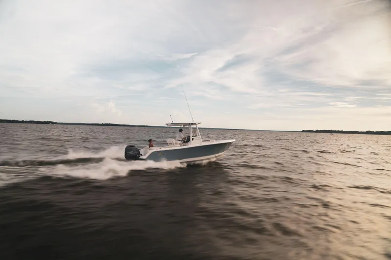 Slide: The Image of 2024 Sea Hunt Ultra 234 speeding on open water. - 28