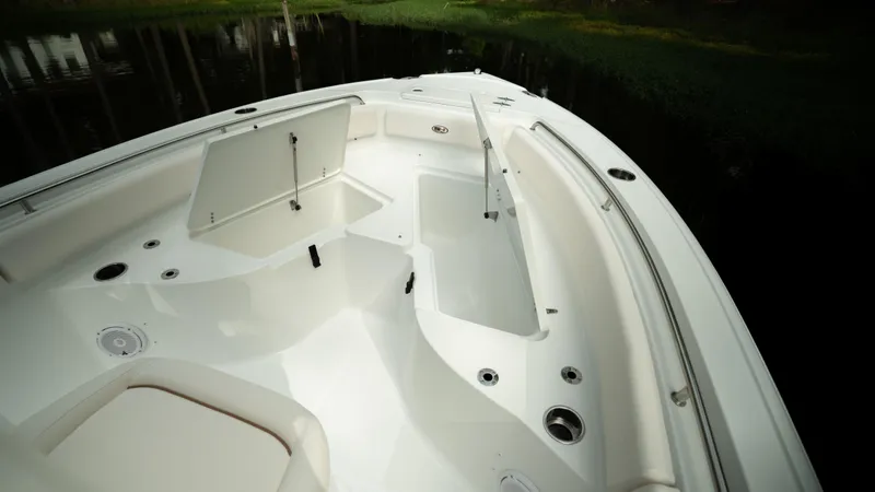 Slide: The Image of 2024 Sea Hunt Ultra 234 boat interior with open storage compartments. - 4