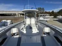 Slide: The Image of 2024 Everglades 315 Center Console boat with sleek design and spacious seating. - 11