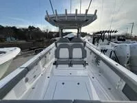 Slide: The Image of 2024 Everglades 315 Center Console boat with spacious deck and seating. - 3