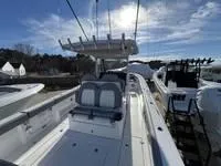 Slide: The Image of 2024 Everglades 315 Center Console boat with sleek design and spacious deck. - 4