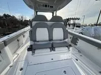 Slide: The Image of 2024 Everglades 315 Center Console boat interior with dual seating and modern design. - 5