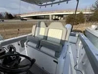 Slide: The Image of 2024 Everglades 315 Center Console boat interior with dual seats and steering wheel. - 6