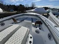 Slide: The Image of 2024 Everglades 315 Center Console boat with spacious deck and seating. - 9