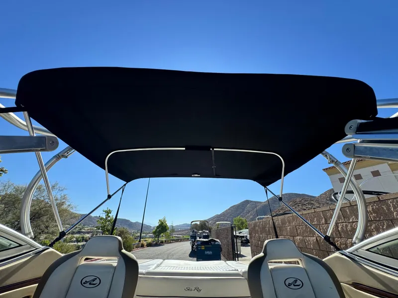 Slide: The Image of 2007 Sea Ray 210 Select boat with bimini top, scenic mountain view. - 10