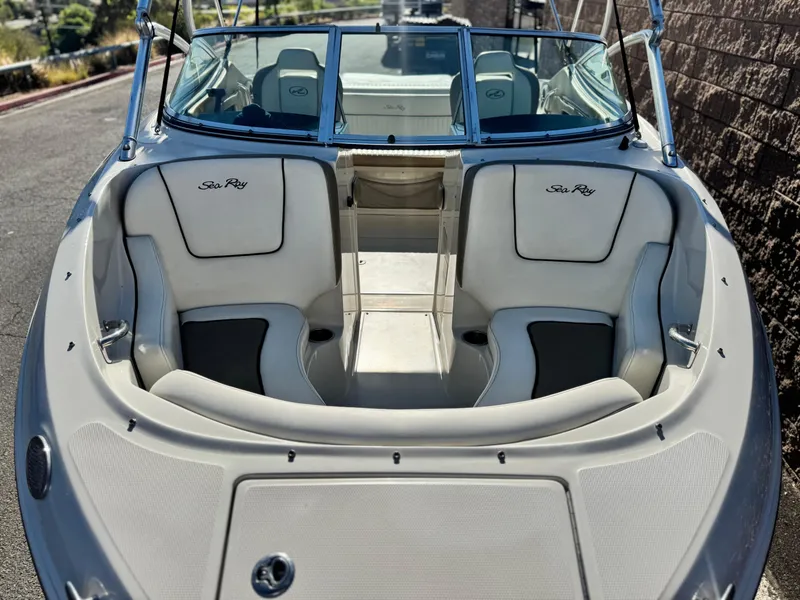 Slide: The Image of 2007 Sea Ray 210 Select boat interior with white seating and windshield. - 11