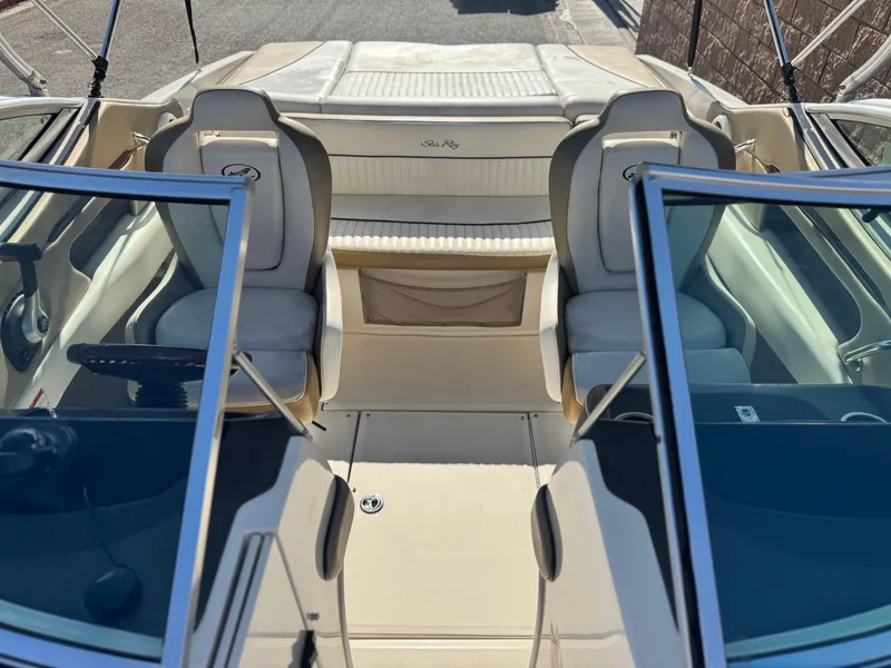 Slide: The Image of 2007 Sea Ray 210 Select boat interior with seating and steering wheel. - 15