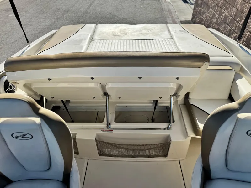 Slide: The Image of 2007 Sea Ray 210 Select boat interior with open storage compartment. - 17