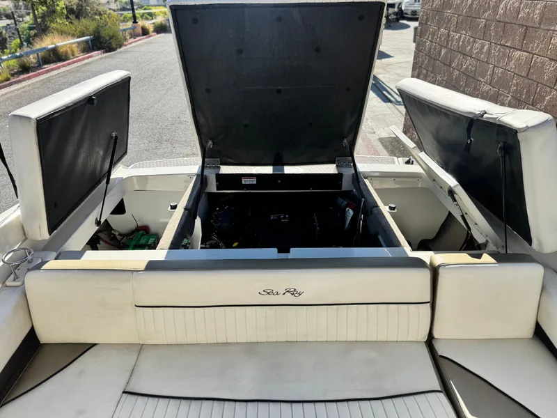 Slide: The Image of 2007 Sea Ray 210 Select boat with open engine compartment, showcasing interior details. - 19