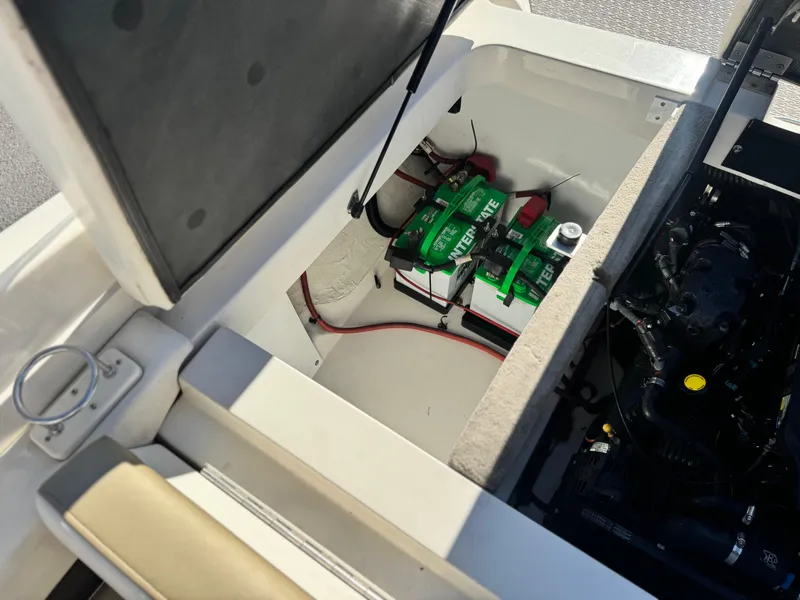 Slide: The Image of 2007 Sea Ray 210 Select boat engine compartment with batteries and wiring. - 21