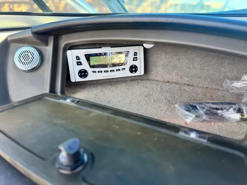 Slide: The Image of 2007 Sea Ray 210 Select boat dashboard with stereo system and speaker. - 24