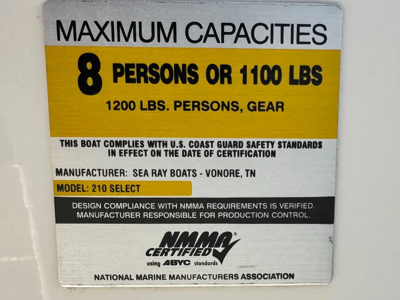 Slide: The Image of Maximum capacity label for 2007 Sea Ray 210 Select, 8 persons or 1100 lbs. NMMA certified. - 29
