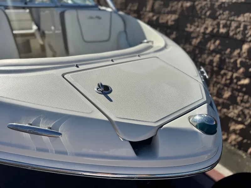 Slide: The Image of 2007 Sea Ray 210 Select boat, close-up of bow with sleek design and chrome details. - 8