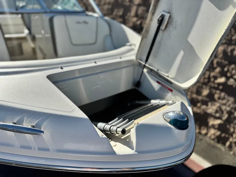 Slide: The Image of Open storage compartment on a 2007 Sea Ray 210 Select boat. - 9