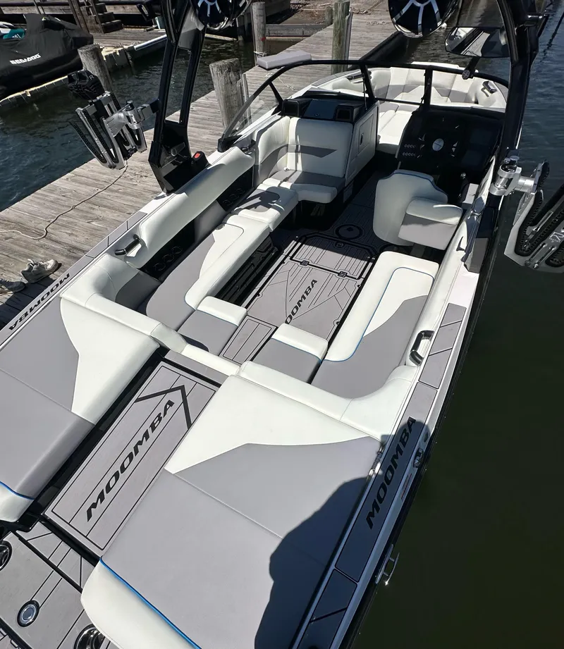 Slide: The Image of 2024 Moomba Mojo boat interior with spacious seating and modern design. - 6