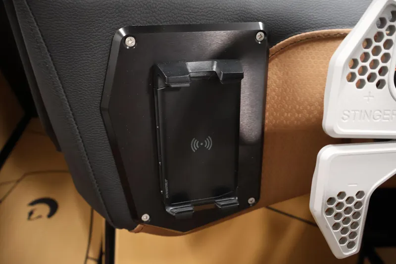 Slide: The Image of Centurion Fe22 2026 interior with wireless charging pad and Stinger audio component. - 18
