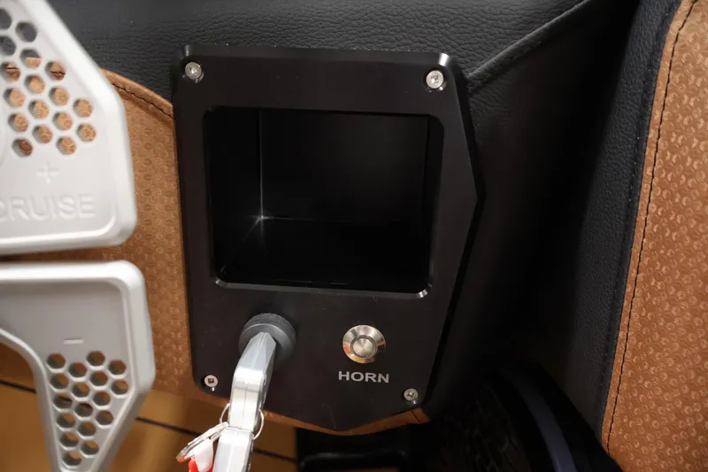 Slide: The Image of Interior detail of 2026 Centurion Fe22, featuring horn button and storage compartment. - 19