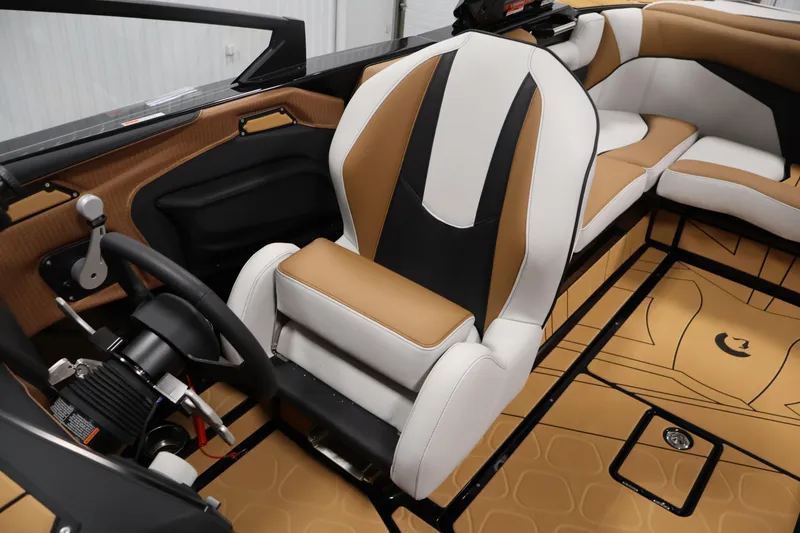 Slide: The Image of Interior of a 2026 Centurion Fe22 boat featuring luxurious seating and modern controls. - 24