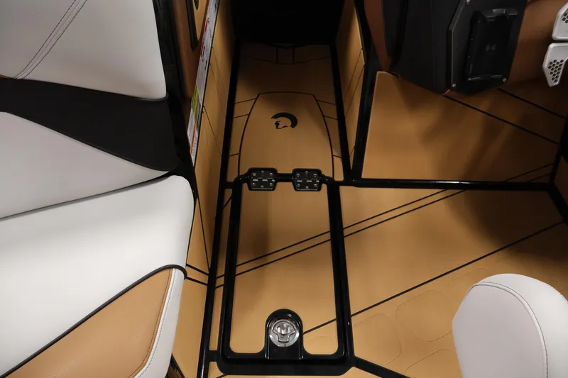 Slide: The Image of Interior of 2026 Centurion Fe22 boat with tan flooring and white seating. - 25