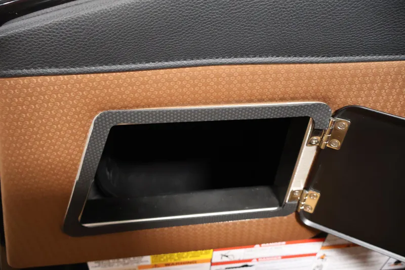 Slide: The Image of Open storage compartment in 2026 Centurion Fe22 boat interior. - 28