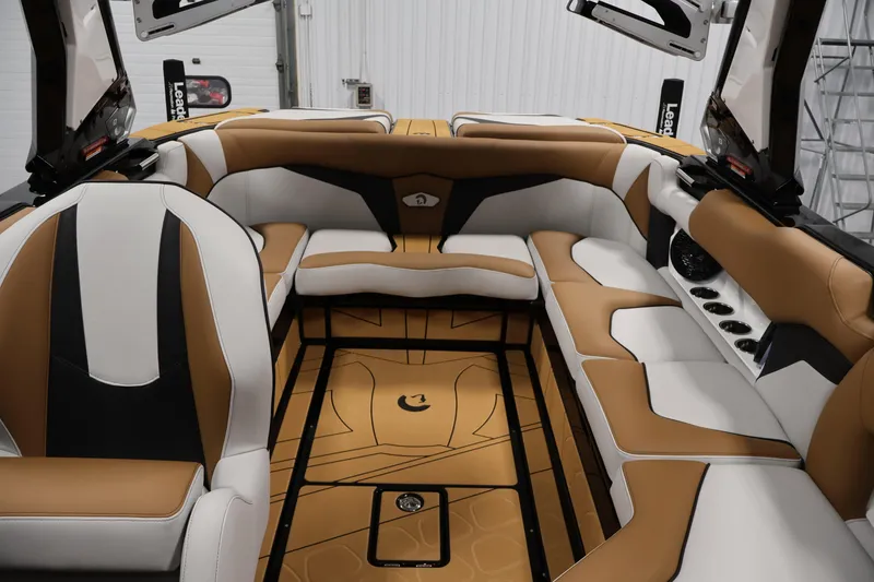 Slide: The Image of Luxurious interior of 2026 Centurion Fe22 boat with tan and white seating. - 30
