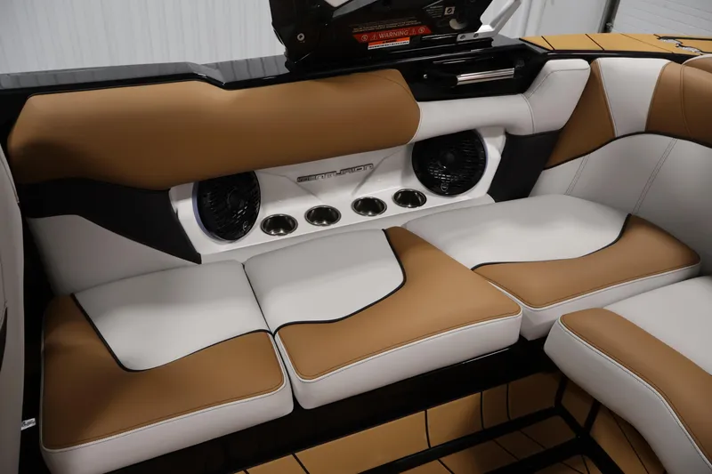 Slide: The Image of Luxurious interior of 2026 Centurion Fe22 boat with tan and white seating. - 32