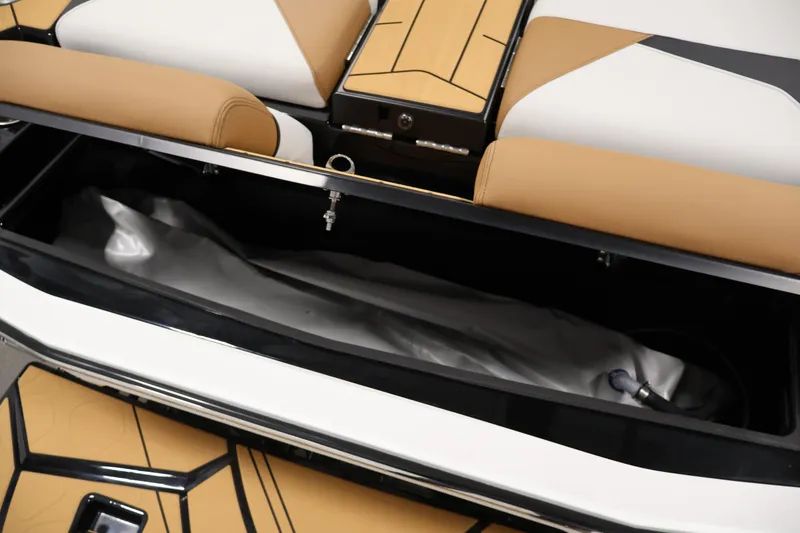 Slide: The Image of Storage compartment in 2026 Centurion Fe22 boat with tan and white seating. - 42
