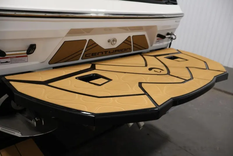 Slide: The Image of 2026 Centurion Fe22 boat swim platform with tan and black design. - 55