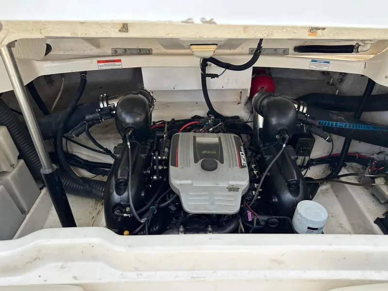 Slide: The Image of Engine compartment of a 2012 Sea Ray SLX 270 boat, featuring a MerCruiser engine. - 4