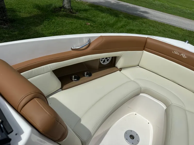 Slide: The Image of Luxurious seating area on a 2012 Sea Ray SLX 270 boat with cup holders and speaker. - 7
