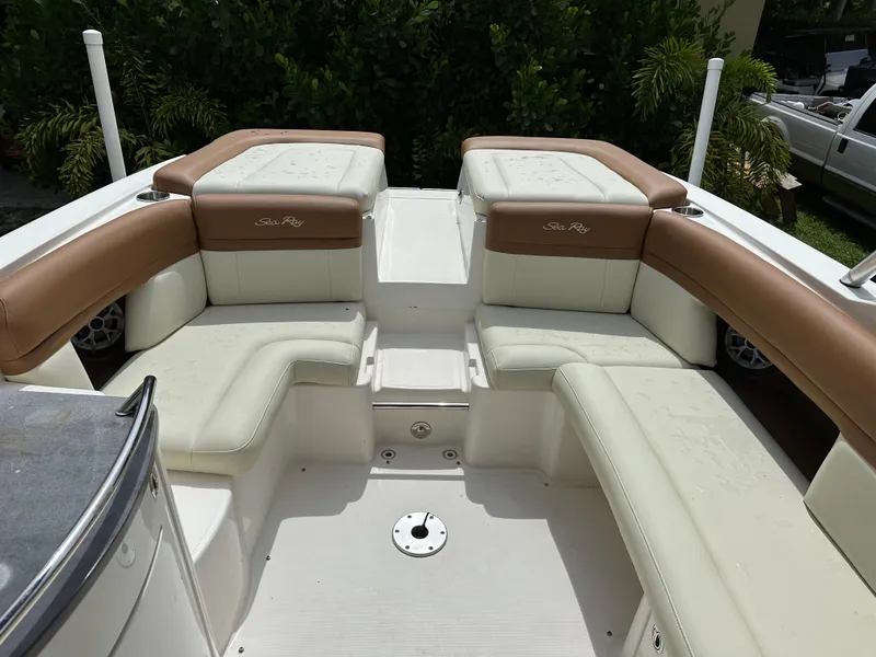 Slide: The Image of 2012 Sea Ray SLX 270 boat interior with beige seating and sleek design. - 8