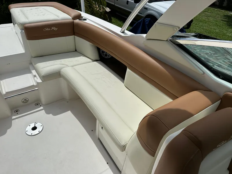 Slide: The Image of 2012 Sea Ray SLX 270 boat interior with beige and white seating. - 9